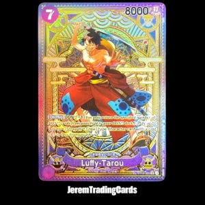 May include: A holographic trading card featuring Luffy-Tarou from the Straw Hat Crew. The card has a purple and gold design with the number 7 in the upper left corner and 8000 in the upper right. The character is depicted in a dynamic pose.