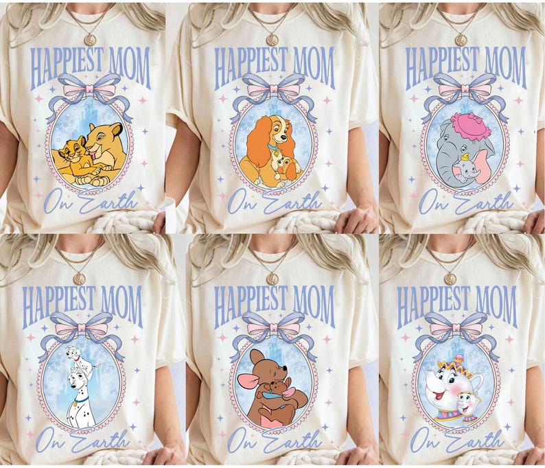 May include: Cream-colored t-shirts with the text "Happiest Mom On Earth" in light blue. Each shirt features a different cartoon image inside an oval frame with a bow. The images include a lion family, a dog family, and an elephant.