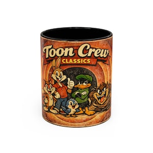 May include: A cylindrical coffee mug with a black interior and a vintage-style design. The mug features the text "Toon Crew Classics" and cartoon characters including Bugs Bunny, Daffy Duck, and Taz.
