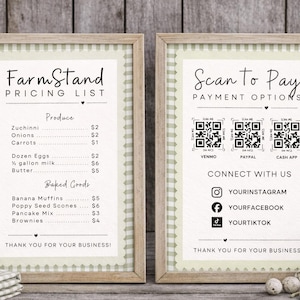 May include: Two framed signs with a light green gingham border. One lists produce and baked goods with prices. The other displays payment options via QR codes and social media links. The signs are on a wooden background.