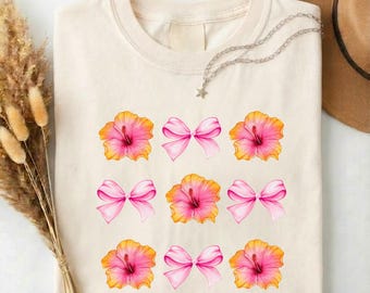 Pink Hibiscus Bow Shirt, Tropical Coquette Tee, Floral Summer T-Shirt, Island Vacation Sweater, Girly Beach Aesthetic Top, Preppy Gift
