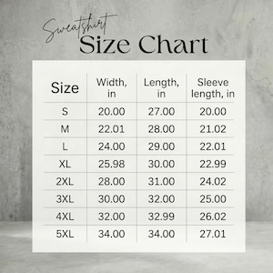 May include: A white sweatshirt size chart, with measurements in inches. The chart includes sizes S to 5XL, listing width, length, and sleeve length. The text "Sweatshirt Size Chart" is at the top.