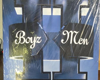 May include: Sealed vinyl record album by Boyz II Men. The album cover features a stylized design in shades of blue and black, with the band's name in white script. The album is still in its original shrink wrap.