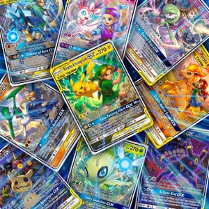 May include: A collection of colourful trading cards featuring various illustrated characters and creatures, including Pikachu, Young Link, and Celebi. Each card displays detailed artwork, text, and game statistics with bright borders.