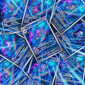 May include: A selection of holographic trading cards featuring Pokémon characters. The cards display a vibrant mix of blue, purple, and green hues, with detailed illustrations and text. The cards are arranged across the image, creating a dynamic and visually appealing composition.