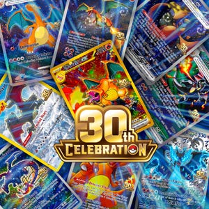 May include: A collection of Charizard trading cards featuring various artistic illustrations of the fire-type creature, all centred around a prominent gold 30th CELEBRATION logo with a Poké Ball icon, showcasing holographic details and text.