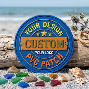May include: A circular blue PVC patch featuring yellow text that reads YOUR DESIGN, three yellow stars, an orange rectangular bar with the dark text CUSTOM, and orange text at the bottom that reads YOUR LOGO PVC PATCH.