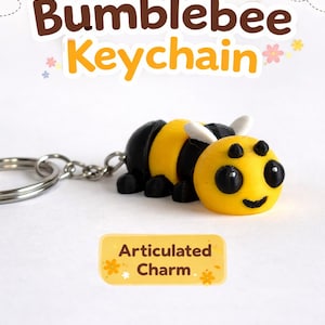 May include: A yellow and black articulated bumblebee keychain. The keychain has a yellow head with black eyes and a smiling mouth. The body is yellow and black striped. The text "Cute Bumblebee Keychain" is above the bumblebee.