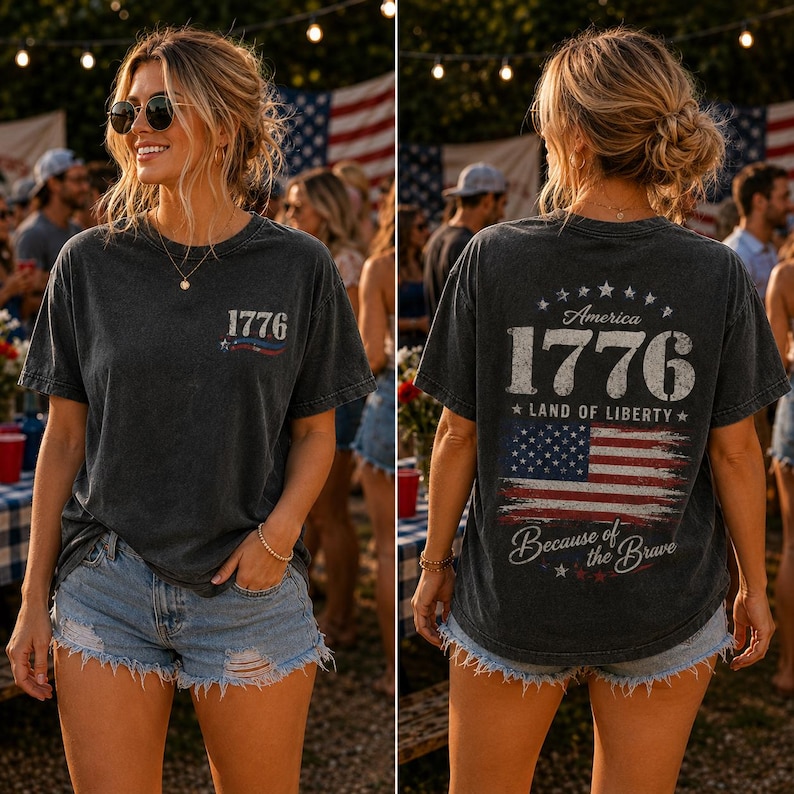 May include: Dark gray t-shirt with the number "1776" and an American flag design. The back of the shirt features the text "America 1776 Land of Liberty" and "Because of the Brave" with a distressed American flag.