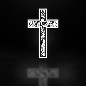 May include: A white cross with intricate floral and swirl designs against a black background. The cross has a shadow, creating a mirrored effect. The design is a symbol of faith and spirituality.