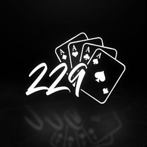 May include: Black and white graphic featuring four playing cards, each displaying an Ace. The number "229" is written in a stylized font. The image has a dark background with a subtle reflection.