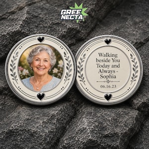 May include: Two circular metal commemorative tokens with a silver-toned finish. One token features a color photograph of an older person with gray hair. The other token displays the text: Walking beside You Today and Always - Sophia 06.16.23.