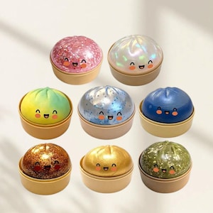 May include: A white ceramic mug with a black handle and the text "But First, Coffee" in a black, bold font. The mug is on a white surface. The mug is likely for hot beverages.