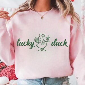 lucky duck shirt,st patricks tee,st patricks day tee,st paddys day shirt,drinking shirt,baby tee y2k,St Patty's Day shirt,St Patrick's Day Tee,trendy baby tee,Shamrock shirt,Lucky shirt,I Put The Double Tee,Funny Duck Shirt,Four Leaf Clover Tee,Feeling Lucky shirt,Feeling Lucky,Coquette St Patricks,clover shirt,Clover Funny Irish,Boxy Crop top