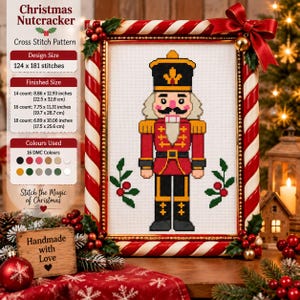 May include: A cross stitch pattern of a nutcracker in a red, black, and gold uniform, framed in a red and white candy cane border with a red bow. The text reads Christmas Nutcracker, Design Size 124 x 181 stitches, and Finished Size 22.5 x 32.8 cm.