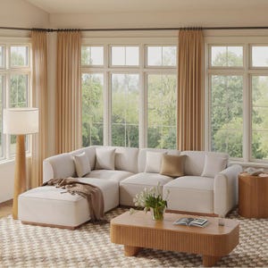 Sofá modular curvo con otomana, moderno, de algodón, con asientos profundos, ideal para sala de estar.