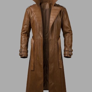May include: A brown leather trench coat with a wide collar, long sleeves, and a belted waist. The coat features decorative stitching on the shoulders and sleeves, and a double-breasted design. The coat is approximately 55 inches long.