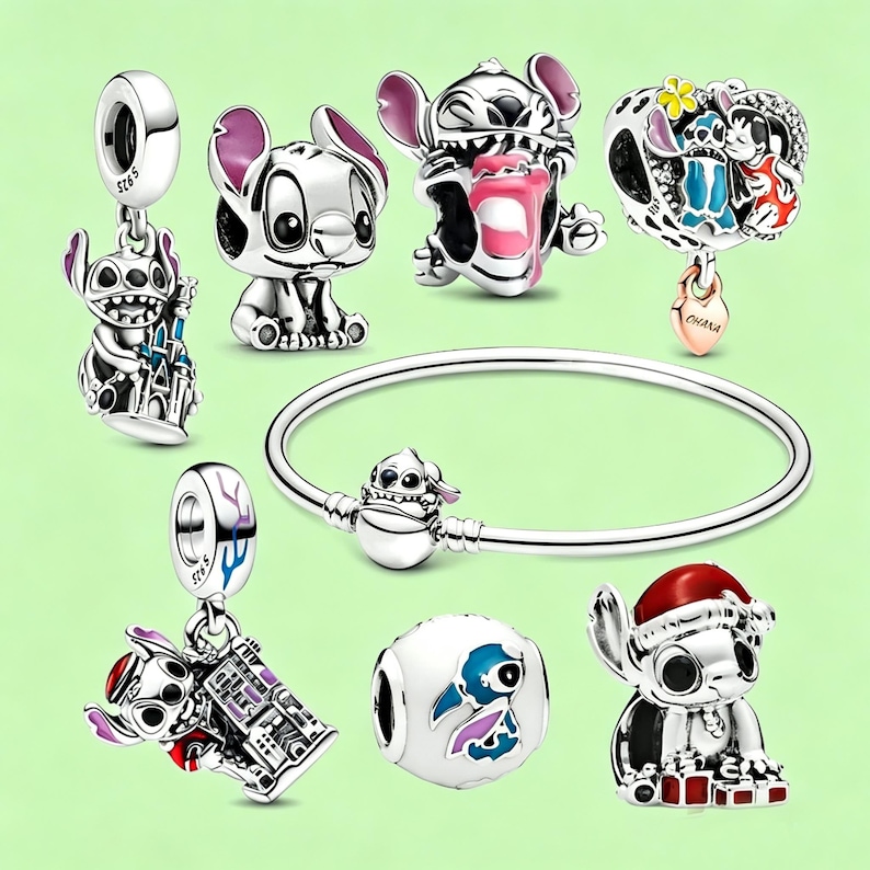 May include: A collection of silver-toned charm beads and a bracelet featuring the character Stitch from Lilo & Stitch. The charms depict Stitch in various poses, some with colorful enamel details, and a bracelet with a clasp featuring Stitch.