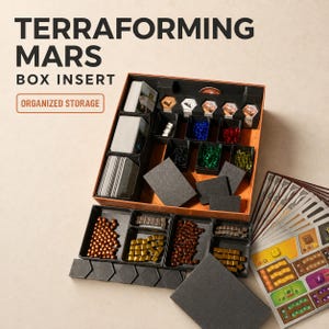 May include: A black plastic board game box insert for Terraforming Mars with organized storage compartments. The insert holds stacks of cards, small colored resource cubes in blue, red, black, green, yellow, copper, and silver, and game tiles.