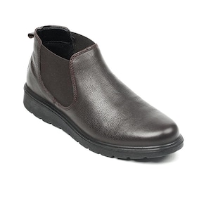 May include: A brown leather Chelsea boot with a rounded toe and a low, black sole. The boot features elastic side panels and a pull tab at the back. The leather has a textured appearance.