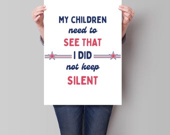 May include: A white poster with blue and red text that reads "My children need to see that I did not keep silent". The text is surrounded by two red stars with blue outlines.