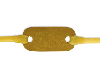 May include: A slingshot pouch made of tan leather with two circular holes, connected to yellow rubber bands. The pouch is rectangular with rounded edges. The rubber bands extend to the sides, ready for use.