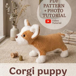 May include: A plush Corgi puppy toy with tan and white fur, standing in profile. The image includes text reading PDF PATTERN + PHOTO TUTORIAL, Video Tutorial, and Corgi puppy. A wooden spool and a metal thimble are placed near the plush toy.