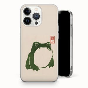 May include: A white ceramic mug with a black handle and the text "But First, Coffee" in a bold, black font. The mug is sitting on a wooden surface. The mug is approximately 4 inches tall.