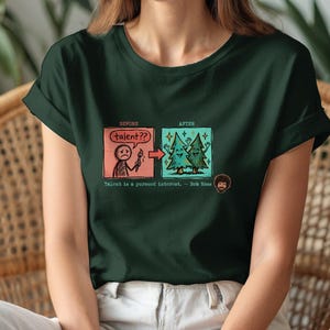 A streetwear-style t-shirt featuring a Y2K cyber-graphic with a portrait of Bob Ross and the quote "Talent is a pursued interest" in bold typography.