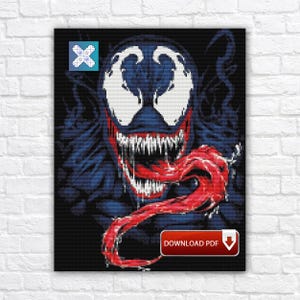 May include: A framed cross-stitch pattern featuring the character Venom from Marvel Comics. The design showcases Venom's face with a wide, toothy grin and a long, red tongue. The color palette includes black, blue, white, and red. The words "DOWNLOAD PDF" are visible.