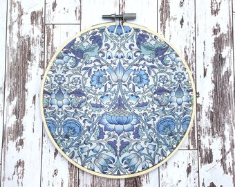 Blue fabric hoop wall art, 6”. Made from upcycled Liberty Lodden remnant. Zero waste art, low budget decor. Sustainable textile wall hanging