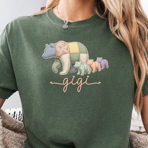 May include: A set of three ceramic mugs with a speckled, matte finish. The mugs are in cream, light grey, and dark grey. Each mug has a simple, minimalist design, ideal for coffee or tea.