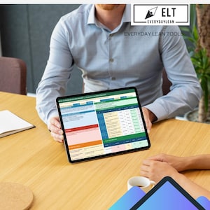 May include: A person holding a tablet displaying a spreadsheet with data. The tablet is black with a thin bezel. The spreadsheet has a green, blue, orange, and yellow color scheme. The image also includes the text "EVERYDAYLEAN TOOLS".