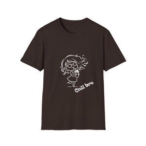 May include: A dark brown t-shirt with a white cartoon illustration of a person drinking from a cup. The text "Chill bro" is below the illustration. The shirt has short sleeves and a crew neck.