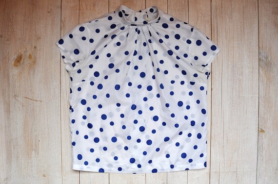 navy blue blouse with white polka dots