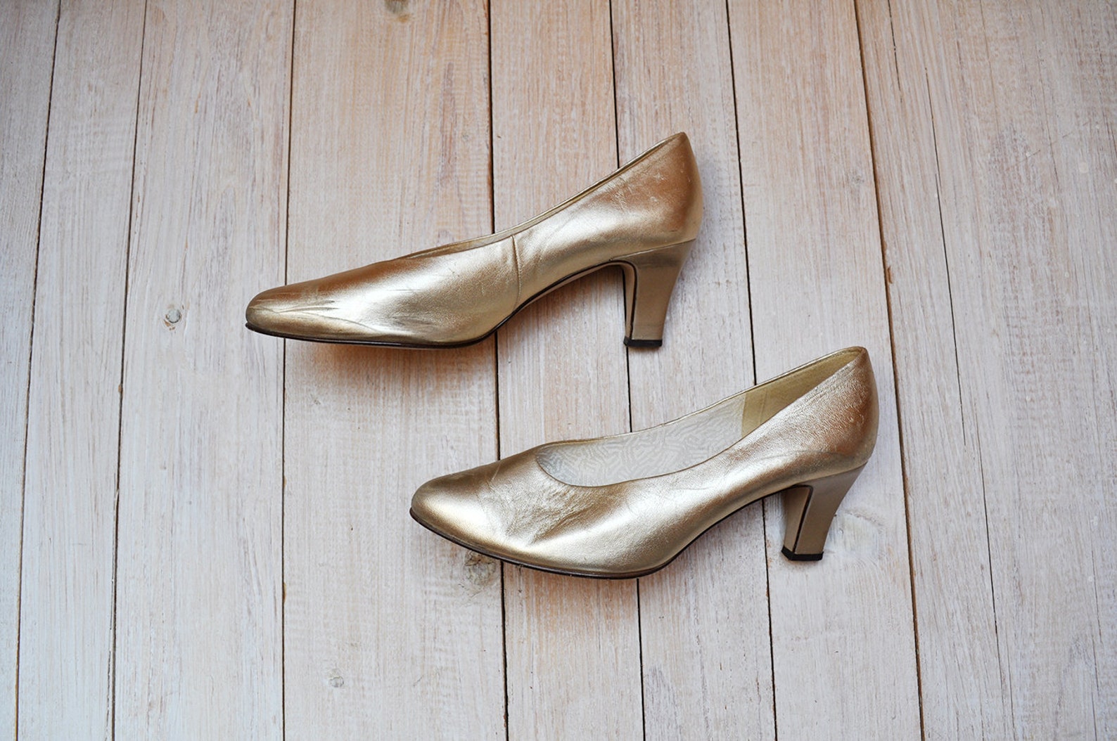 gold leather pumps