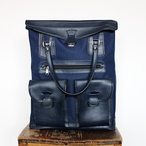Vintage marineblauwe kunstleer en canvas retrobagage veganistische reistas