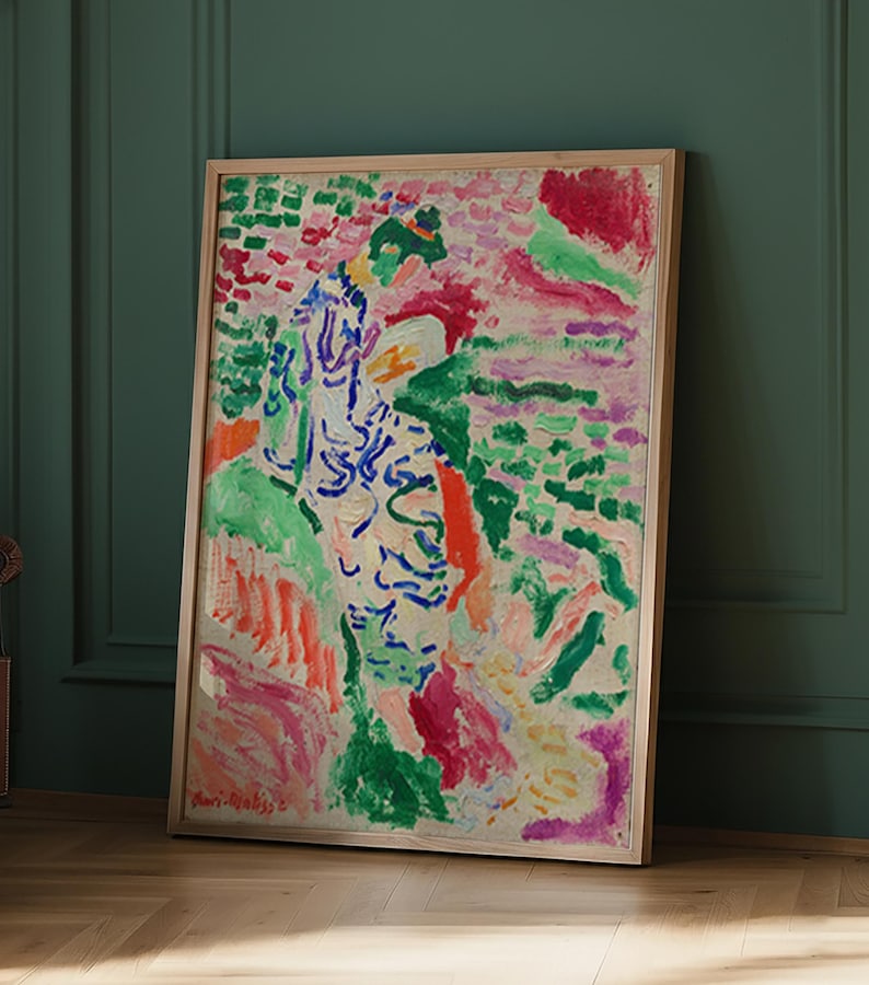 May include: A framed abstract painting with a wooden frame. The artwork features a vibrant mix of colors, including green, red, blue, and pink. The style appears to be impressionistic, with visible brushstrokes and a textured appearance. The artist's signature is visible in the bottom left corner.