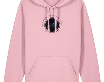 May include: A light pink hoodie with a front pocket and drawstring hood. A circular graphic on the chest features a constellation design with the words "Imaginative, Compassionate, Soulful" around the edge. The hoodie is made of a soft material.