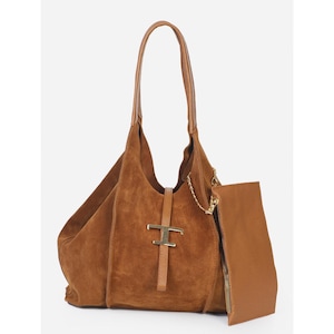 May include: A brown suede shoulder bag with a matching pouch. The bag features a gold-tone metal clasp and a long handle. The pouch has a zipper closure and a gold chain detail. The bag is a rich, warm brown color.