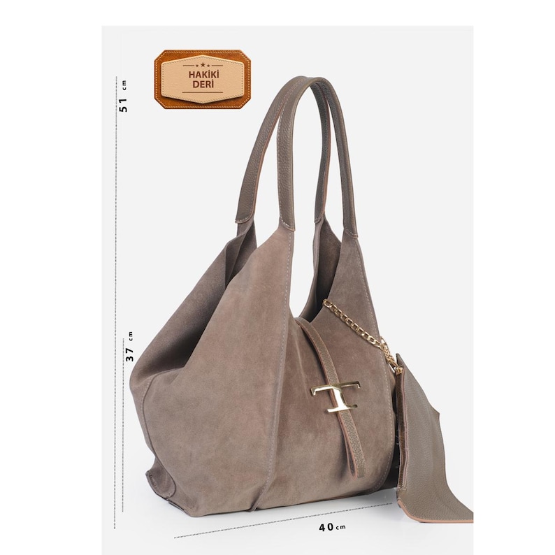 May include: Taupe suede shoulder bag, 51 cm high, 40 cm wide, and 37 cm deep. Features a gold-tone chain and hardware. Includes a small attached pouch. The bag has a soft, slouchy design and two long handles. The tag reads "HAKIKI DERI".