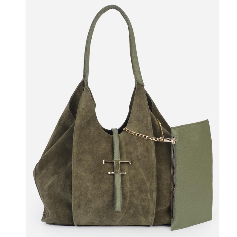 May include: Olive green suede shoulder bag with a matching detachable pouch. The bag features a gold-tone chain and a gold-tone metal clasp with a logo. The bag has a single handle and a soft, unstructured shape.