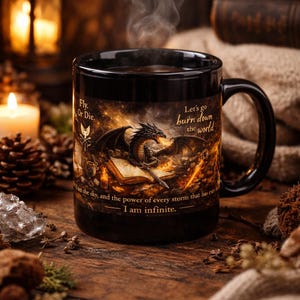 May include: Black ceramic mug with a dragon illustration and text that reads "Fly Or Die" and "Let's go burn down the world." The mug has a black handle and is filled with a hot beverage, with steam rising from the top.
