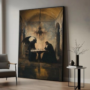 May include: Large framed artwork depicting a chess game between a cloaked figure and a horned demon. The painting has a dark, gothic aesthetic with a muted color palette of browns and blacks. A chandelier hangs above the chess table.