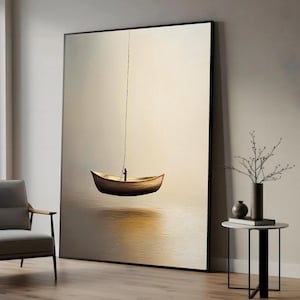 May include: A large framed artwork depicts a small wooden boat suspended in the air by a rope. A tiny figure stands in the boat, against a soft, neutral background. The painting has a minimalist style with a focus on the boat and the figure.