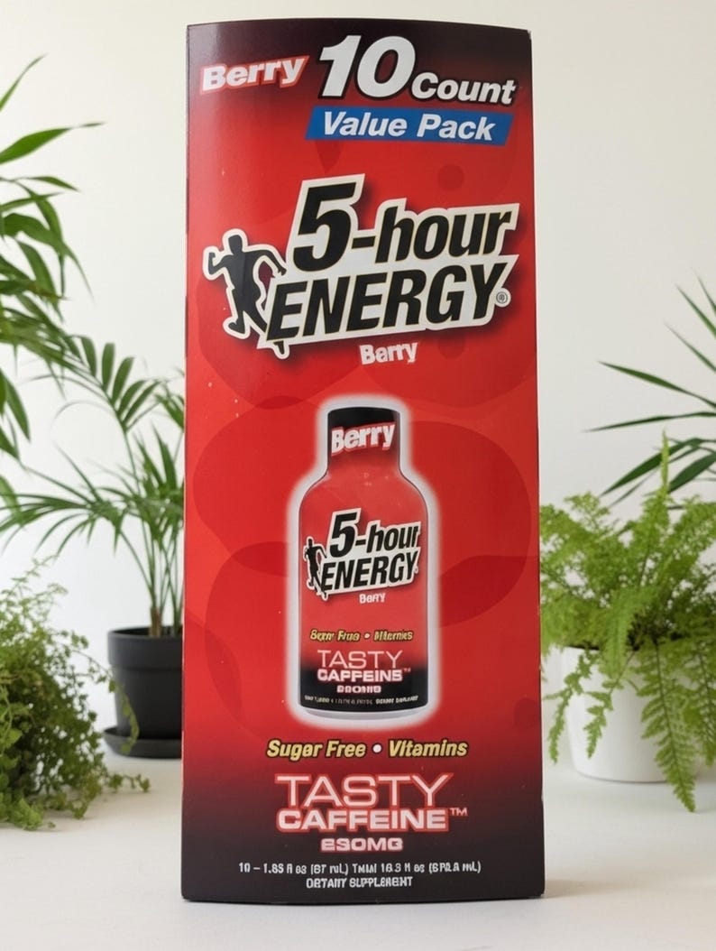 May include: A red and black 5-hour ENERGY Berry flavor 10-count value pack. The box features the product name, a silhouette of a person, and the words "Tasty Caffeine". The box also states that the product is sugar-free and contains vitamins.