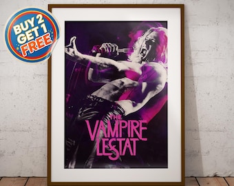 May include: A framed poster featuring a high-contrast, purple and black graphic of a long-haired figure singing into a microphone with the text THE VAMPIRE LESTAT in bold pink letters. A circular sticker in the top left corner reads BUY 2 GET 1 FREE.