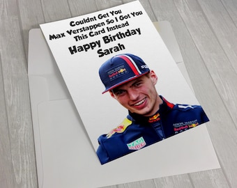 May include: A birthday card featuring a smiling man wearing a blue cap with red and white accents. The card includes the text "Couldnt Get You Max Verstappen So I Got You This Card Instead Happy Birthday Sarah."