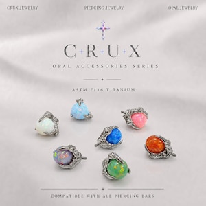 May include: Six titanium piercing jewelry pieces featuring spherical opals in white, light blue, pink, dark blue, orange, and green, each held by a metallic claw setting. Text includes CRUX JEWELRY, PIERCING JEWELRY, OPAL ACCESSORIES SERIES, and ASTM F136 TITANIUM.