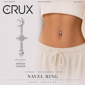 May include: A silver-toned titanium navel ring featuring a crescent moon top with a small clear stone, a central starburst charm encrusted with clear stones, and a dangling clear stone above a small silver star-shaped charm at the bottom.